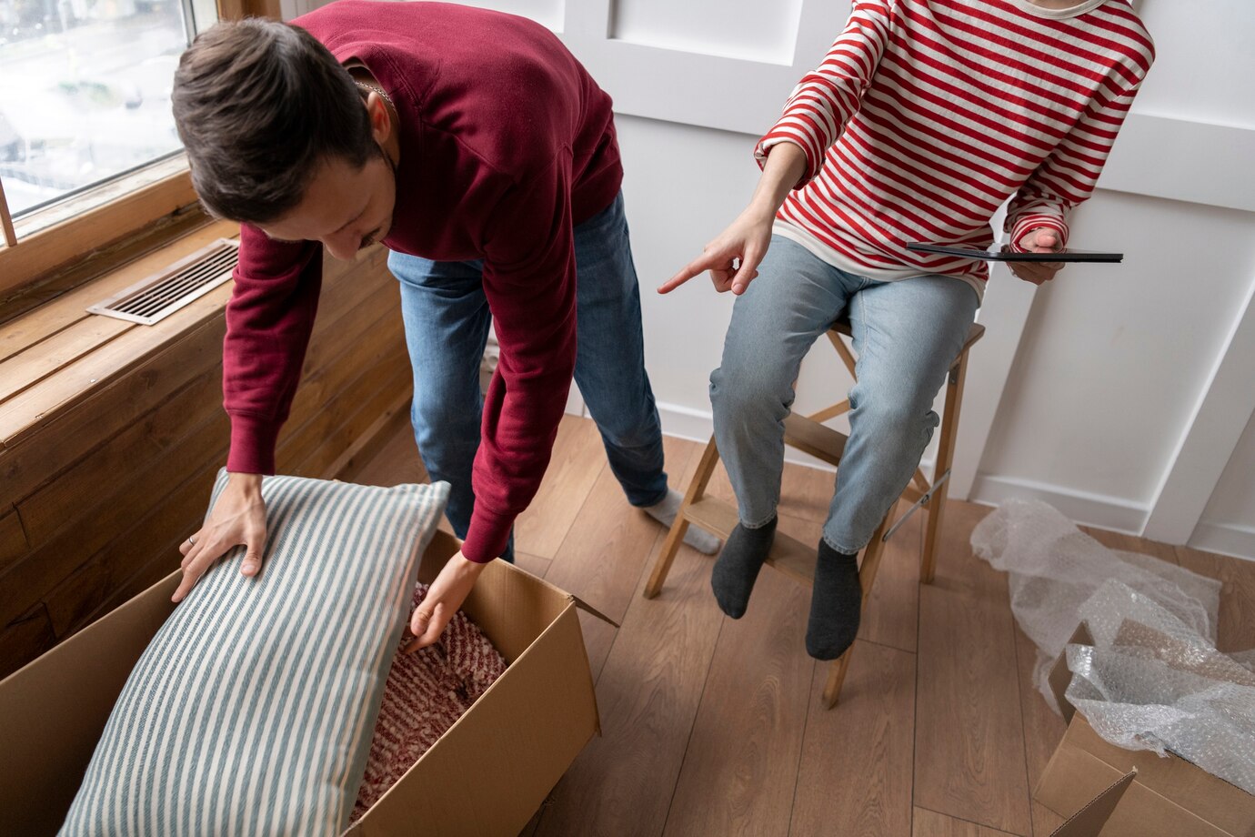 young-couple-moving-into-new-home_23-2149199077